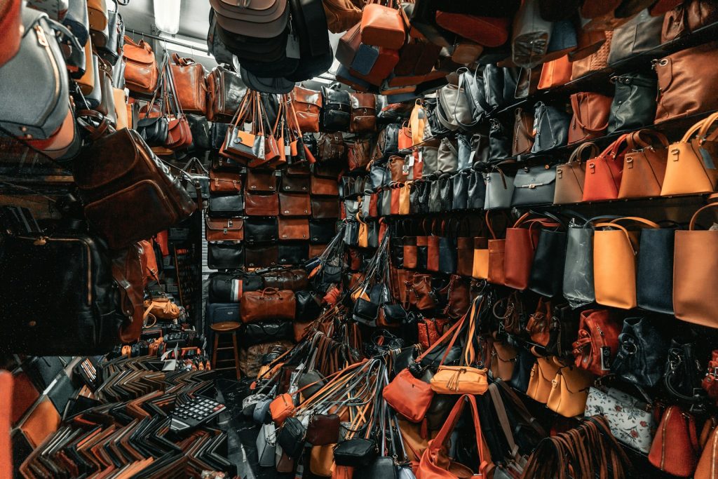 a room filled with lots of purses and handbags